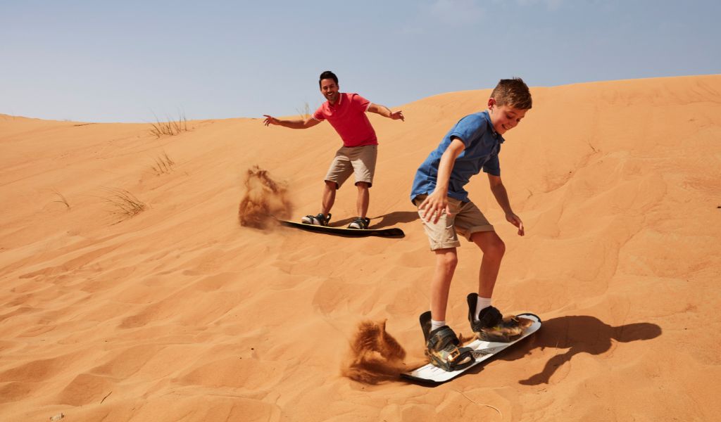 Desert sandboarding in Dubai - Dubai sports travel city guide